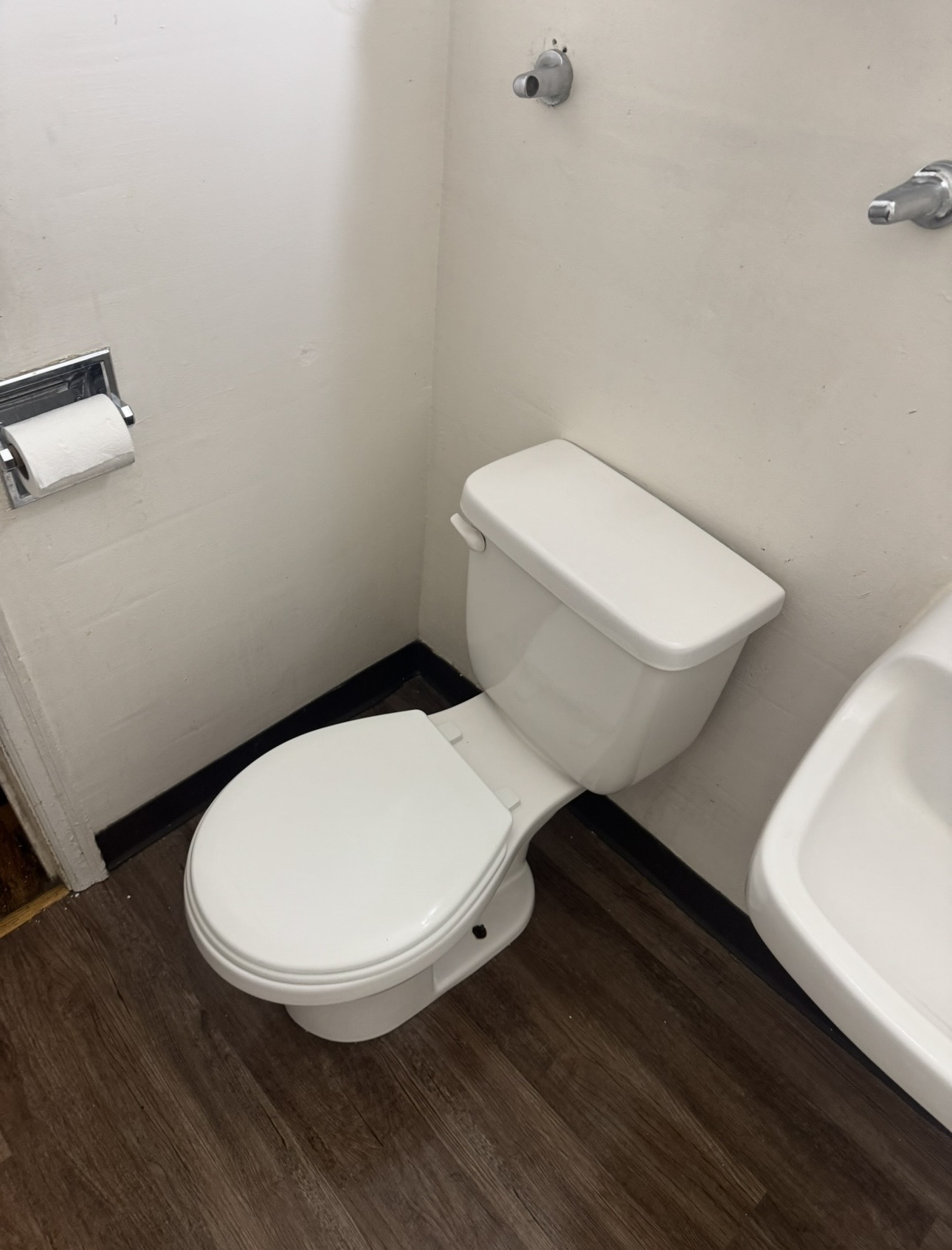 Bathroom toilet area after cleaning - sanitized and spotless
