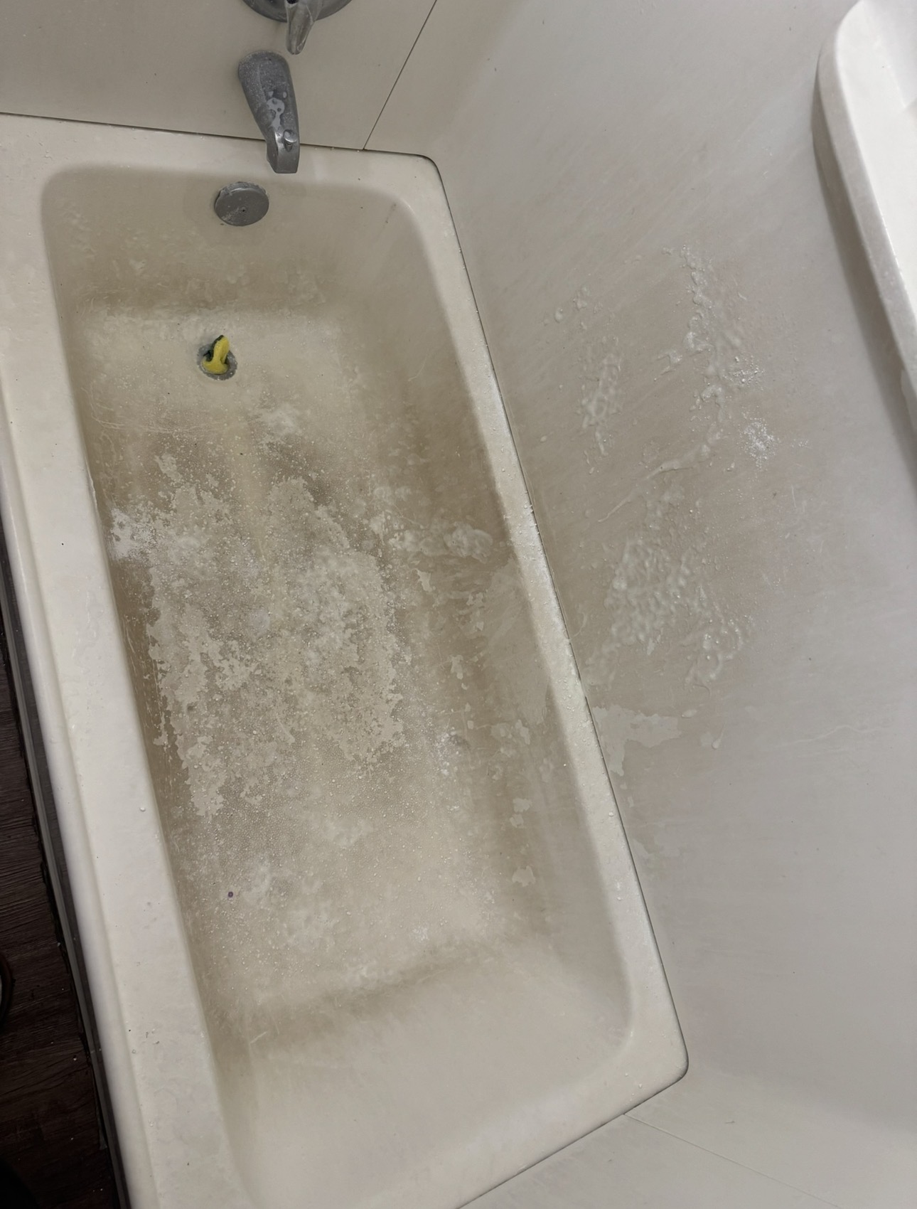 Bathtub before cleaning - stained and dirty