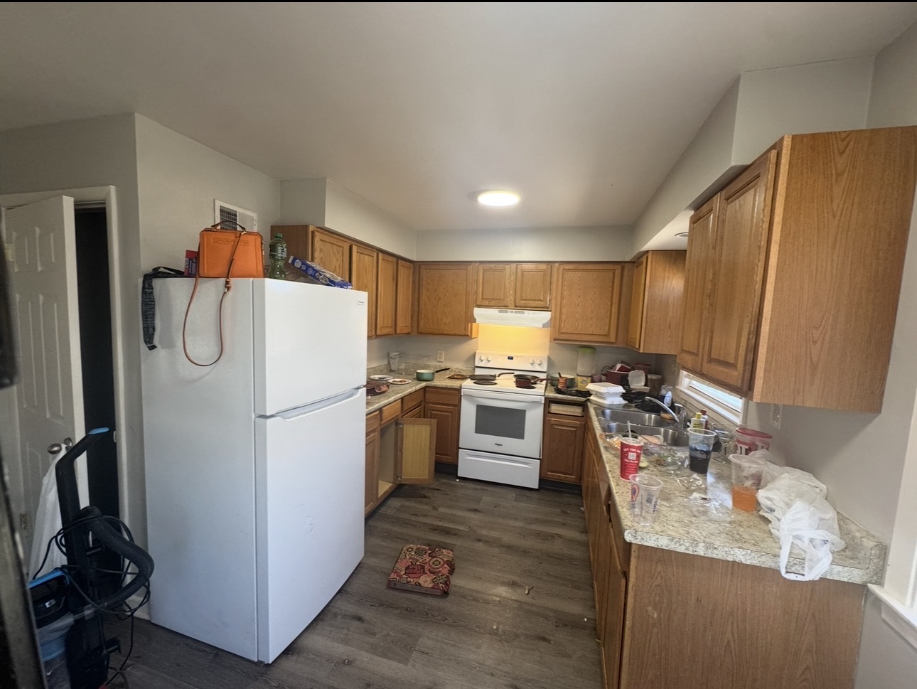 Kitchen before cleaning - cluttered counters